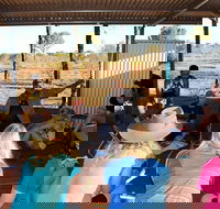 Aboriginal Homelands Experience from Ayers Rock including Sunset - Events Australia