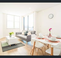 Gorgeous modern brand new two bedroom apartment with large lounge and private garden view balcony - Events Australia